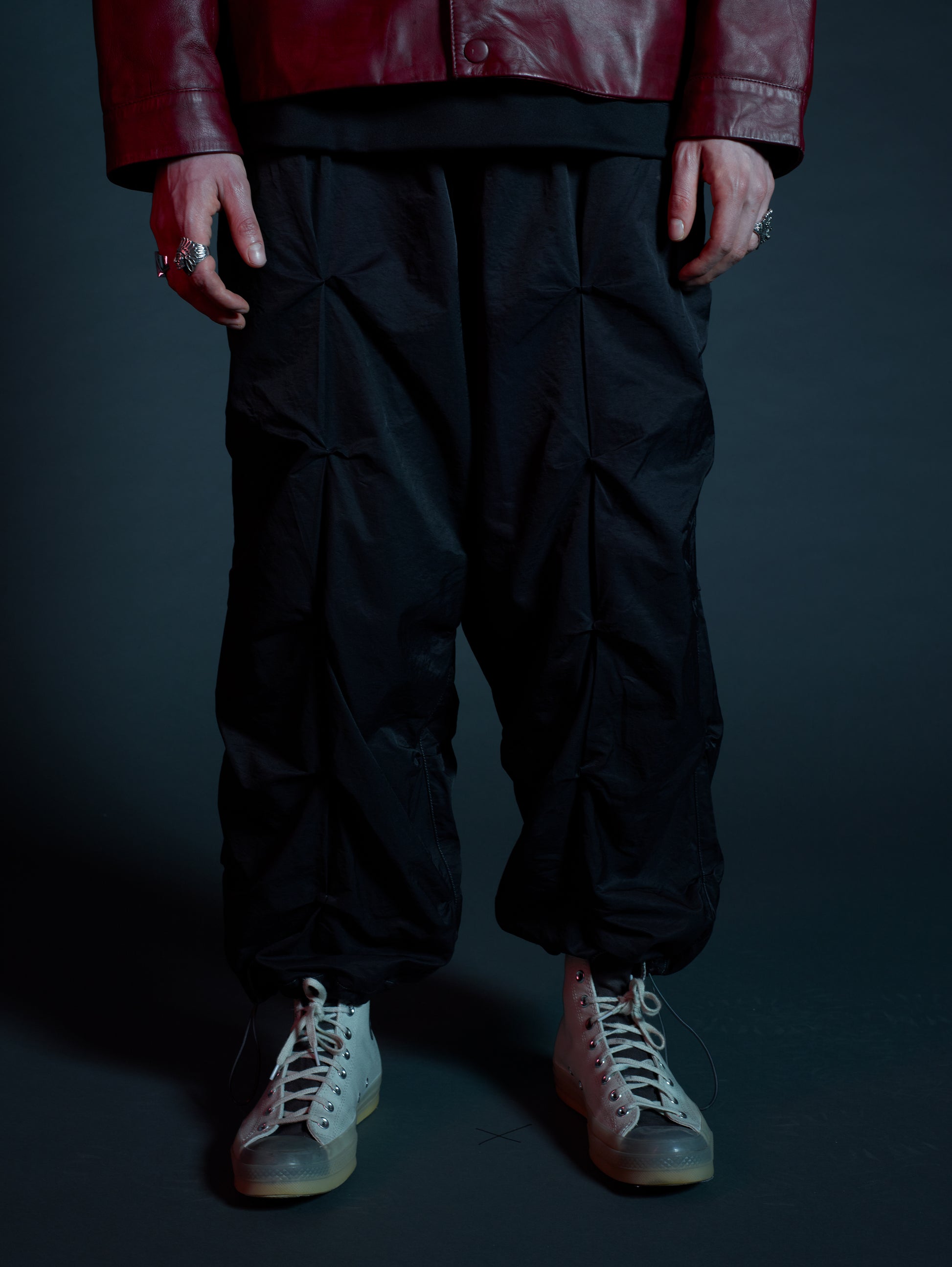 Front view of Martial oversized black streetwear cargos with ruched detail