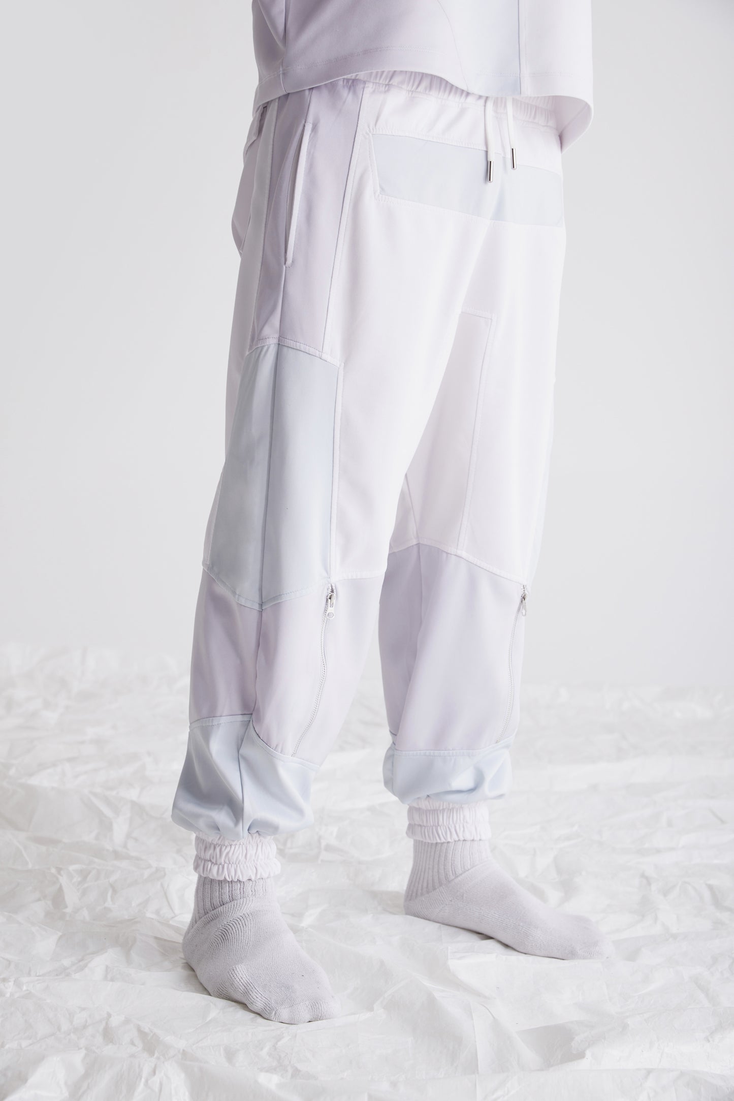Close-up of drawcord waistband with metal tips on streetwear pants