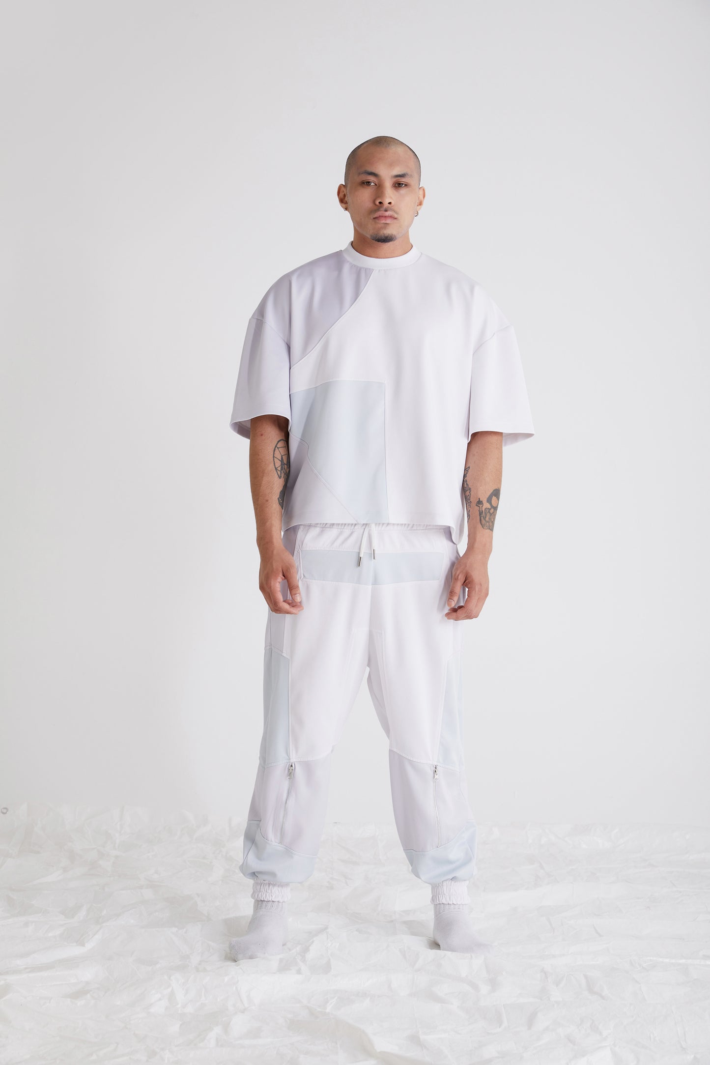 Oversized fit colour block streetwear tee for men styled with sweatpants