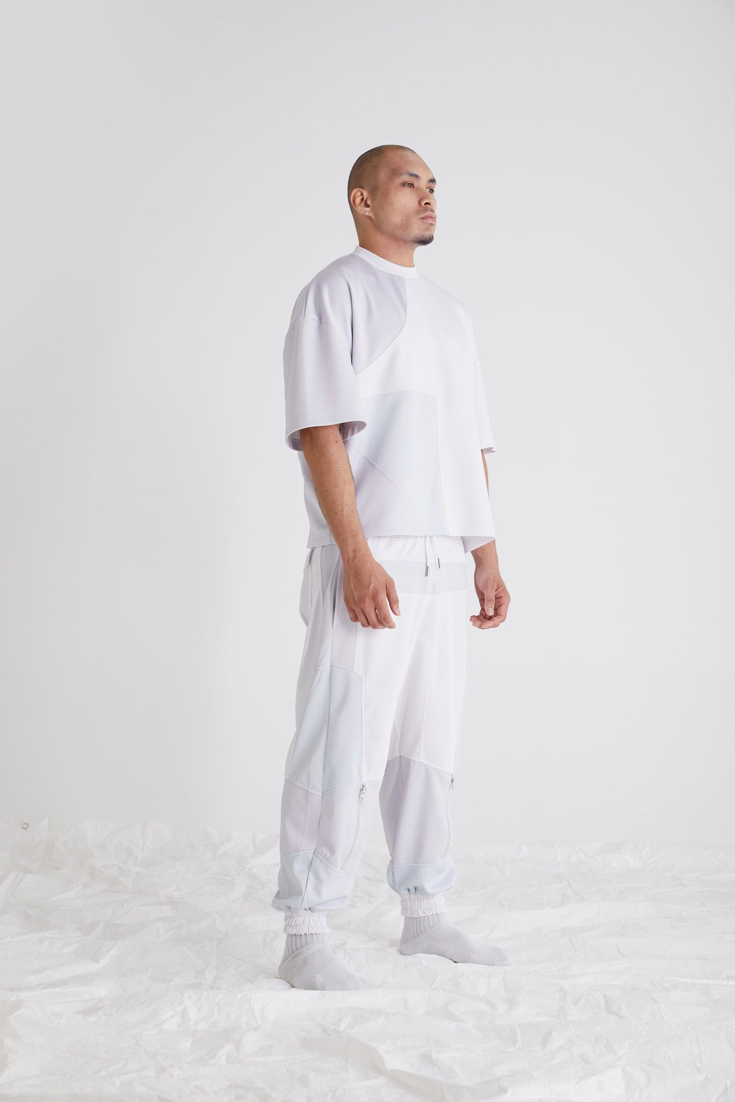Side view of oversized mens streetwear tee with modern panel construction