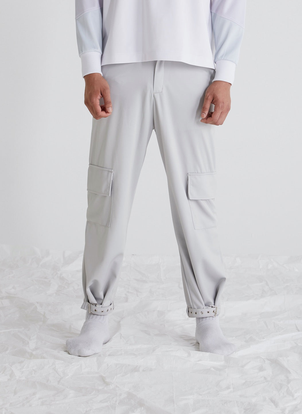 Satori wide leg adjustable hem trousers front view, relaxed hem for low rise shoes, buckle fastening for high top shoes, modern menswear, versatile style.