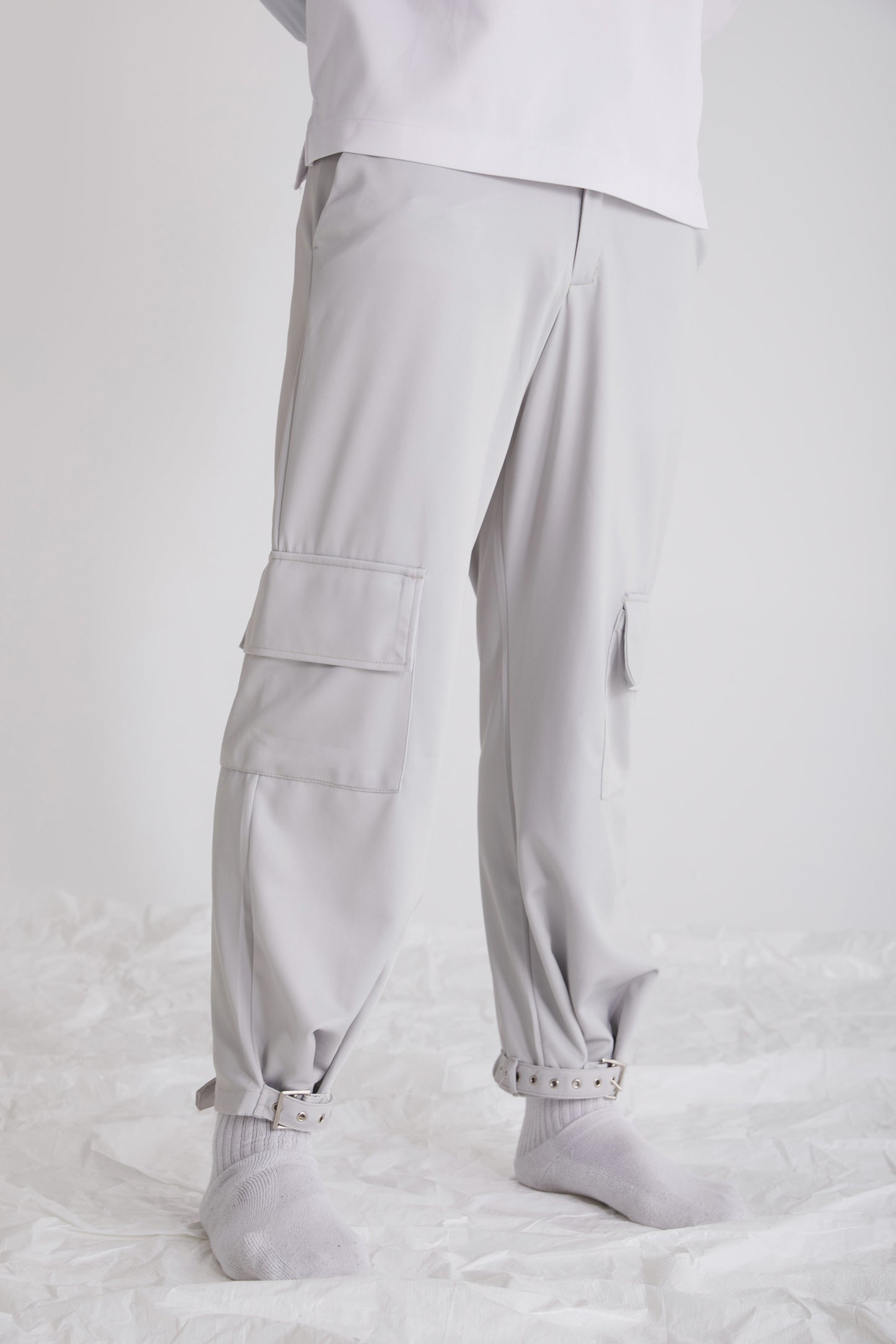 Side profile of Satori wide leg trousers styled with high-top shoes